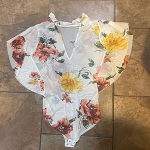 It’s a bodysuit see-through flower print